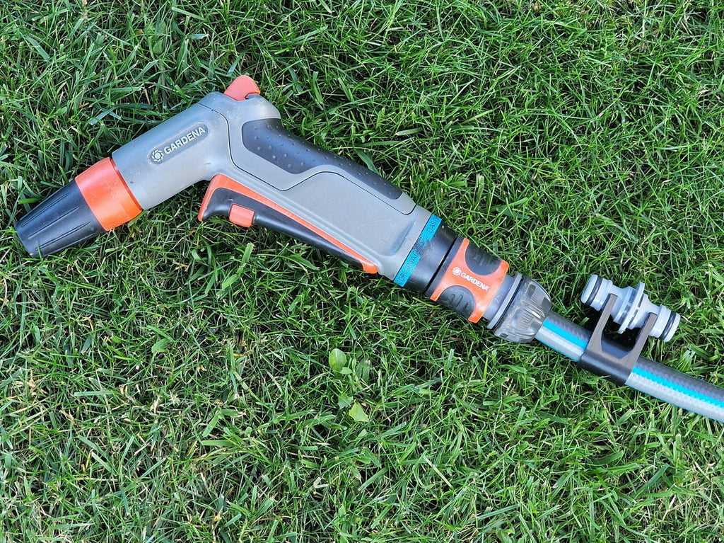 Hose and assembly holder for extension coupler